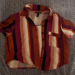 Colorful and very soft fabric. It’s a crop button up shirt. Super stylish!